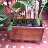 jardineras-de-madera-con-ruedas-para-el-exterior-